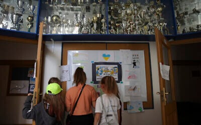 Ukrainian refugee children look at the drawings at the Lauder Morasha Jewish school in Warsaw, Poland, Thursday, July 28, 2022.  (AP Photo/Michal Dyjuk)