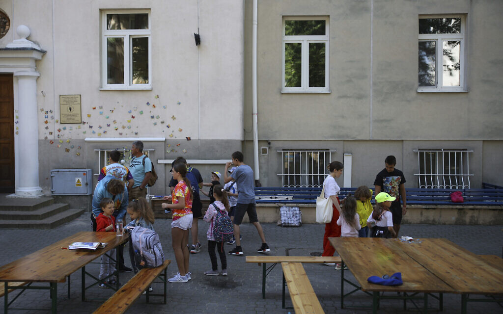 Ukrainian refugee children gather outside the Lauder Morasha Jewish school in Warsaw, Poland, Thursday, July 28, 2022. (AP Photo/Michal Dyjuk) Ukrainian refugee children gather outside the Lauder Morasha Jewish school in Warsaw, Poland, Thursday, July 28, 2022. (AP Photo/Michal Dyjuk)