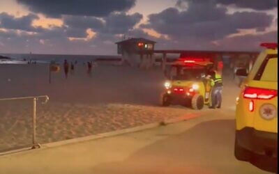 Screen capture from video of MDA medics responding to a near drowning on an Ashkelon beach, July 12, 2022. (Ynet)