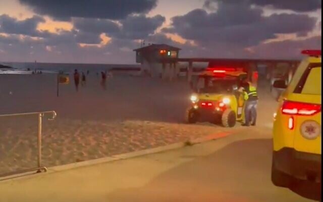 Screen capture from video of MDA medics responding to a near drowning on an Ashkelon beach, July 12, 2022. (Ynet) Screen capture from video of MDA medics responding to a near drowning on an Ashkelon beach, July 12, 2022. (Ynet)