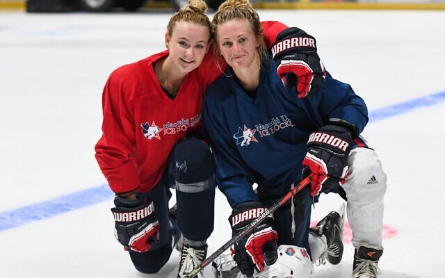 Chelsey Goldberg (R), captain of the Maccabi USA women's ice hockey team, posing for a photo. (Joya Create)