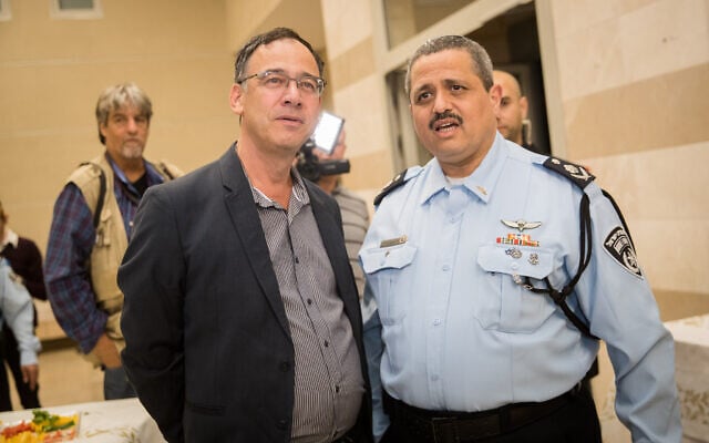 Outgoing Israel Police chief Roni Alsheich (right) with State Prosecutor Shai Nitzan during a farewell ceremony in his honor in Beit Shemesh on November 29, 2018. (Yonatan Sindel/Flash90) Outgoing Israel Police chief Roni Alsheich (right) with State Prosecutor Shai Nitzan during a farewell ceremony in his honor in Beit Shemesh on November 29, 2018. (Yonatan Sindel/Flash90)