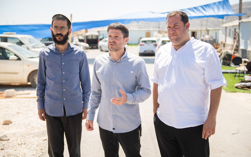 Head of the Religious Zionist Party MK Bezalel Smotrich, center, visits the illegal settlement outpost of Evyatar, in the West Bank, together with Nachala Settlement Movement leader director Tzvi Elimelech Sharbaf and Samaria Regional Council head Yossi Dagan, on June 27, 2021. (Sraya Diamant/Flash90) Head of the Religious Zionist Party MK Bezalel Smotrich, center, visits the illegal settlement outpost of Evyatar, in the West Bank, together with Nachala Settlement Movement leader director Tzvi Elimelech Sharbaf and Samaria Regional Council head Yossi Dagan, on June 27, 2021. (Sraya Diamant/Flash90)