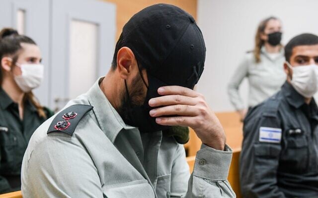 File: Lt. Col. Dan Sharoni, an IDF officer accused of of secretly filming his female soldiers, at a hearing at a military court in Tel Aviv, December 7, 2021. (Avshalom Sassoni/Flash90) File: Lt. Col. Dan Sharoni, an IDF officer accused of of secretly filming his female soldiers, at a hearing at a military court in Tel Aviv, December 7, 2021. (Avshalom Sassoni/Flash90)