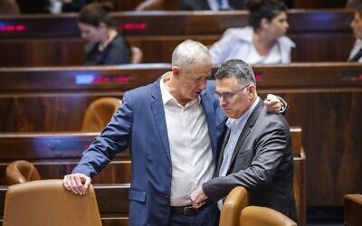 Defense Minister Benny Gantz (L) and Justice Minister Gideon Sa'ar at the Knesset in Jerusalem, on June 22, 2022. (Olivier Fitoussi/Flash90)