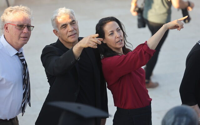 Then-minister of foreign affairs Yair Lapid and his wife Lihi Lapid attend their son's graduation ceremony at Ariel University on June 28, 2022. (Flash90)
