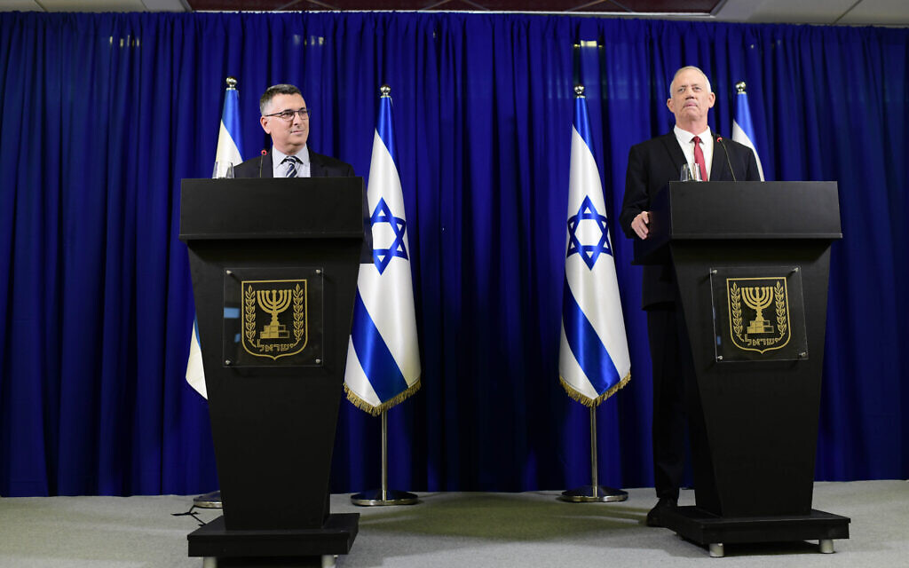 Justice Minister Gideon Saar and Defense Minister Benny Gantz hold a press conference announcing a merger of their parties, July 10, 2022. (Tomer Neuberg/Flash90) Justice Minister Gideon Saar and Defense Minister Benny Gantz hold a press conference announcing a merger of their parties, July 10, 2022. (Tomer Neuberg/Flash90)
