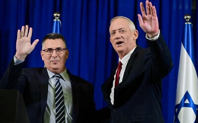 Justice Minister Gideon Saar and Defense Minister Benny Gantz hold a press conference announcing a merger of their parties, July 10, 2022. (Tomer Neuberg/ Flash90)