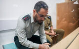 Dan Sharoni, an IDF officer accused of sexual offenses, arrives for a hearing at a military court in Beit Lid, July 24, 2022. (Flash90)