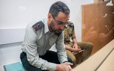 Dan Sharoni, an IDF officer accused of sexual offenses, arrives for a hearing at a military court in Beit Lid, July 24, 2022. (Flash90)