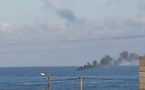 Smoke rises from a vessel off the coast of the Gaza Strip, after the Israeli Navy opens fire at it, amid an alleged smuggling attempt. (Social media)