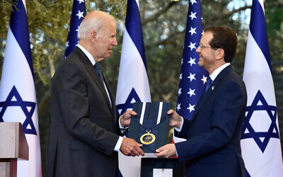 President Isaac Herzog presents the Israeli Presidential Medal of Honor to US President Joe Biden at the President's Residence in Jerusalem. on July 14, 2022. (Haim Zach / GPO) President Isaac Herzog presents the Israeli Presidential Medal of Honor to US President Joe Biden at the President's Residence in Jerusalem. on July 14, 2022. (Haim Zach / GPO)