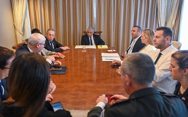 Prime Minister Yair Lapid meets with his staff ahead of his meeting with US President Joe Biden, July 14, 2022
(Kobi Gideon/GPO) Prime Minister Yair Lapid meets with his staff ahead of his meeting with US President Joe Biden, July 14, 2022
(Kobi Gideon/GPO)