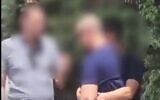 Screen capture from video reportedly showing a suspect reenacting for police how he tried to snatch a teenage girl and force her into the trunk of his car, July 11, 2022. (Twitter)