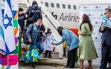 Then-Immigration Minister Pnina Tamano-Shata, center, in blue coat, welcomes new immigrants from Ukraine at Ben Gurion Airport in Israel, in an undated photo distributed by the Immigration and Absorption Ministry on July 6, 2022. (Courtesy: Naga Malasa)