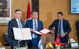 Justice Minister Gideon Sa'ar and his Moroccan counterpart Abdellatif Ouahbi sign a bilateral agreement on legal cooperation in Rabat on July 26, 2022. (Courtesy)