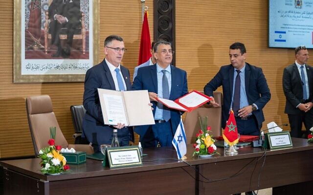 Justice Minister Gideon Sa'ar (left) signs a deal with his Moroccan counterpart, Abdellatif Ouahbi, in Rabat on July 26, 2022. (Courtesy) Justice Minister Gideon Sa'ar (left) signs a deal with his Moroccan counterpart, Abdellatif Ouahbi, in Rabat on July 26, 2022. (Courtesy)