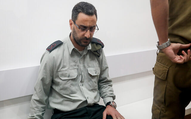 Lt. Col. Dan Sharoni, an IDF officer accused of sexual offenses, arrives for a court hearing at a military court in Beit Lid, July 24, 2022. (Flash90) Lt. Col. Dan Sharoni, an IDF officer accused of sexual offenses, arrives for a court hearing at a military court in Beit Lid, July 24, 2022. (Flash90)