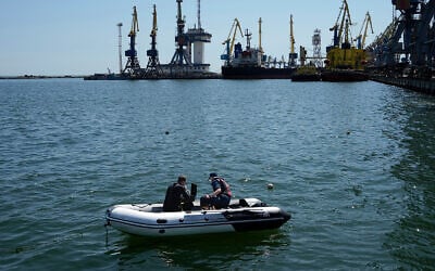 Servicemen of pro-Russia Donetsk People's Republic Emergency Ministry work to defuse a Ukrainian mine in an area of the Mariupol Sea Port, on April 29, 2022. (AP Photo, File) Servicemen of pro-Russia Donetsk People's Republic Emergency Ministry work to defuse a Ukrainian mine in an area of the Mariupol Sea Port, on April 29, 2022. (AP Photo, File)