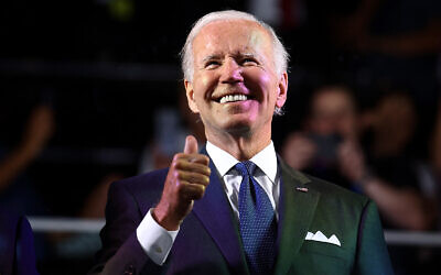 US President Joe Biden reacts as he attends the the openning ceremony of the Maccabiah Games in Jerusalem, July 14, 2022. (Ronen Zvulun/Pool via AP)