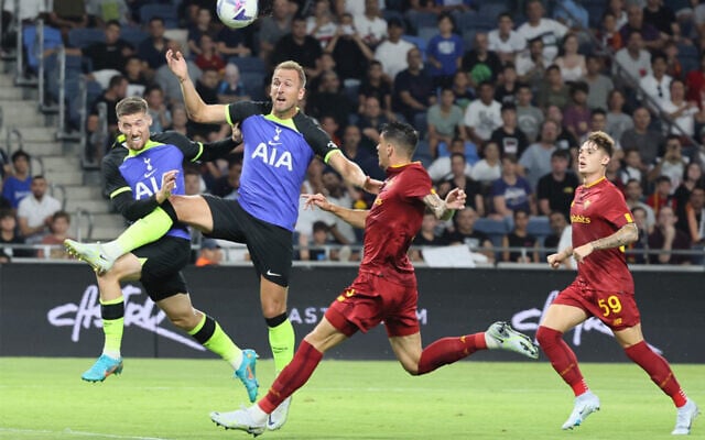 Tottenham Hotspur's English striker Harry Kane, 2nd from left, vies for the ball with Roma's Brazilian defender Roger, center, during a friendly match between England's Tottenham Hotspurs and Italy's AS Roma at the Sammy Ofer Stadium in Haifa, July 30, 2022. (Jack Guez/AFP) Tottenham Hotspur's English striker Harry Kane, 2nd from left, vies for the ball with Roma's Brazilian defender Roger, center, during a friendly match between England's Tottenham Hotspurs and Italy's AS Roma at the Sammy Ofer Stadium in Haifa, July 30, 2022. (Jack Guez/AFP)