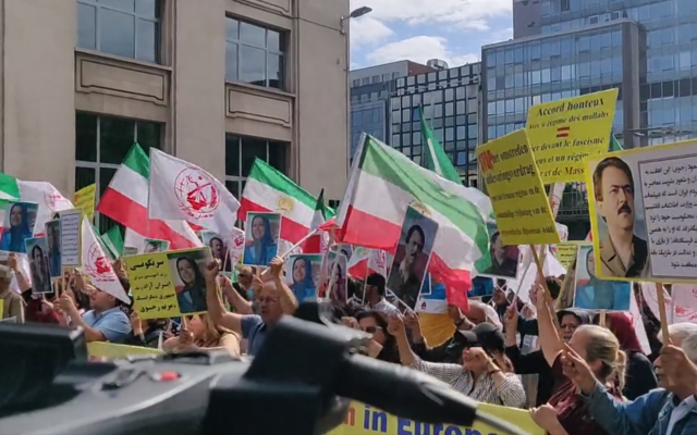 Anti-regime Iranian dissidents protest outside the Belgian Parliament against a prisoner exchange deal with Tehran that will potentially see the release of convicted Iranian agent and terrorist Assadollah Assadi on July 5, 2022. (Screenshot/Twitter) Anti-regime Iranian dissidents protest outside the Belgian Parliament against a prisoner exchange deal with Tehran that will potentially see the release of convicted Iranian agent and terrorist Assadollah Assadi on July 5, 2022. (Screenshot/Twitter)