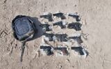 Illustrative: weapons seized by security forces near Neve Ur in northern Israel, after an alleged gun-smuggling over the border with Jordan on July 8, 2022. (Israel Police)