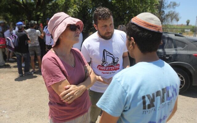An activist from the Nachala Settlement Movement organization confronts a Peace Now activist at a rally point for Peace Now, which is sending volunteers into the West Bank to stymie Nachala's effort to establish three new settlement outposts. (Courtesy Peace Now) An activist from the Nachala Settlement Movement organization confronts a Peace Now activist at a rally point for Peace Now, which is sending volunteers into the West Bank to stymie Nachala's effort to establish three new settlement outposts. (Courtesy Peace Now)