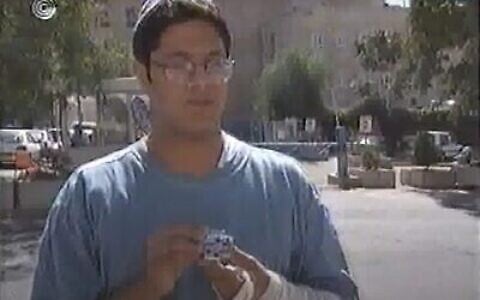 Itamar Ben Gvir seen holding a hood ornament taken from prime minister Yitzhak Rabin’s car, in an October 1995 interview. (Screen capture: YouTube/IBA)