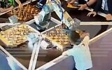 Robot traps a boy's finger during chess game, fracturing it, July 2022 (Screen grab)