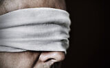 Illsutrative: An imprisoned man whose eyes are blindfolded (nito100; iStock by Getty Images)