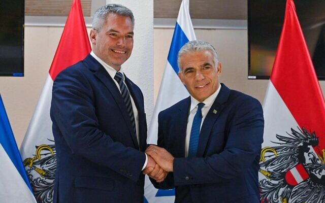 Prime Minister Yair Lapid, right, meets Austrian Chancellor Karl Nehammer in Tel Aviv, July 12, 2022. (Amos Ben Gershom/GPO) Prime Minister Yair Lapid, right, meets Austrian Chancellor Karl Nehammer in Tel Aviv, July 12, 2022. (Amos Ben Gershom/GPO)