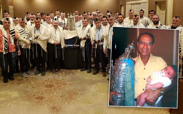 Jack Abraham with his family Torah, which has been used by his family and the Jewish community around the world for almost two decades. (Courtesy via JTA) Jack Abraham with his family Torah, which has been used by his family and the Jewish community around the world for almost two decades. (Courtesy via JTA)