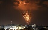Palestinians in Gaza fire rockets at Israel on August 5, 2022. (MAHMUD HAMS / AFP)