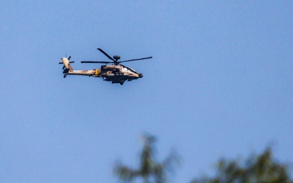 An Israeli military AH-64 Apache attack helicopter flies over southern Israel on August 7, 2022. (Jack Guez/AFP)