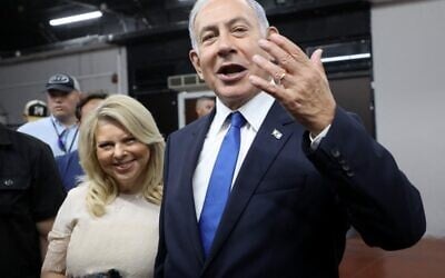 Likud party leader and former prime minister Benjamin Netanyahu gestures after voting next to his wife Sara in a primary to fill out the party's Knesset slate, in Tel Aviv on August 10, 2022. (Gil Cohen-Magen/AFP) Likud party leader and former prime minister Benjamin Netanyahu gestures after voting next to his wife Sara in a primary to fill out the party's Knesset slate, in Tel Aviv on August 10, 2022. (Gil Cohen-Magen/AFP)