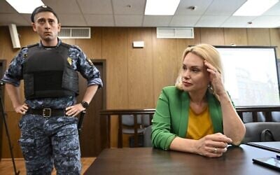 Marina Ovsyannikova (R), the journalist who became known internationally after protesting against the Russian military action in Ukraine during a prime-time news broadcast on state television, appears in court in Moscow, July 28, 2022. (Alexander NEMENOV / AFP)