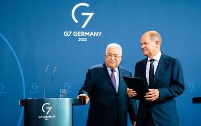 German Chancellor Olaf Scholz and Palestinian Authority President Mahmoud Abbas leave after a press conference at the Chancellery in Berlin, Germany, on August 16, 2022. (JENS SCHLUETER / AFP)