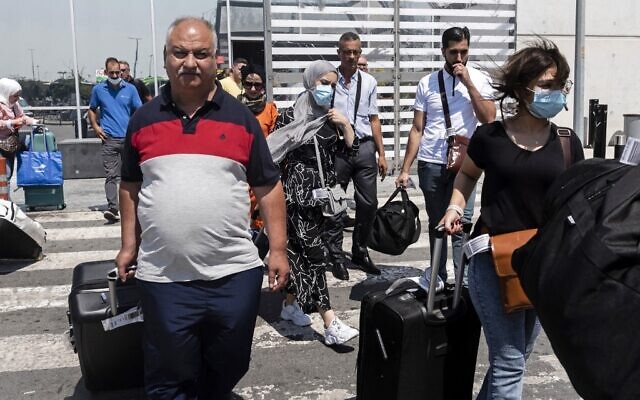 Palestinians leave Larnaca International Airport after arriving aboard the first flight from Israel's Ramon airport, in Cyprus on August 22, 2022 (Iakovos HATZISTAVROU / AFP) Palestinians leave Larnaca International Airport after arriving aboard the first flight from Israel's Ramon airport, in Cyprus on August 22, 2022 (Iakovos HATZISTAVROU / AFP)