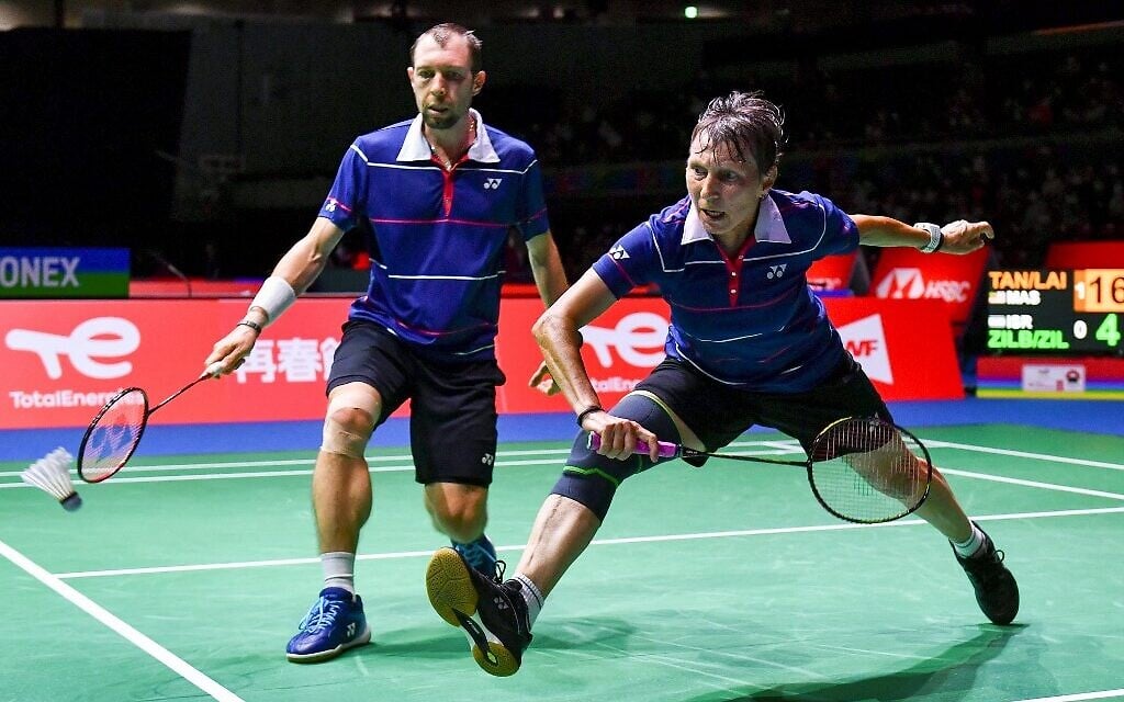 Israeli mother-and-son pair Svetlana Zilberman (R) and Misha Zilberman hit a return in their mixed doubles event against Malaysian pair Tan Kian Meng and Lai Pei Jing on day two of the Badminton World Championships in Tokyo on August 23, 2022. (Kazuhiro NOGI / AFP) Israeli mother-and-son pair Svetlana Zilberman (R) and Misha Zilberman hit a return in their mixed doubles event against Malaysian pair Tan Kian Meng and Lai Pei Jing on day two of the Badminton World Championships in Tokyo on August 23, 2022. (Kazuhiro NOGI / AFP)