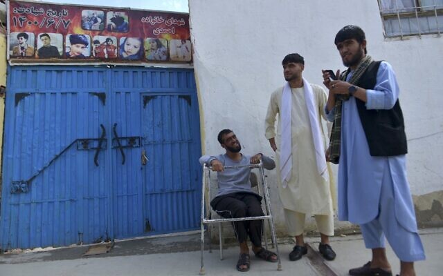 Nasratullah Malikzada (R), the nephew of Aimal Ahmadi, stands outside the house where a US drone strike was carried out in Kabul, August 27, 2022. (Ahmad SAHEL ARMAN / AFP) Nasratullah Malikzada (R), the nephew of Aimal Ahmadi, stands outside the house where a US drone strike was carried out in Kabul, August 27, 2022. (Ahmad SAHEL ARMAN / AFP)