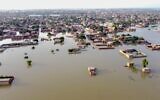 An aerial view shows a flooded residential area after heavy monsoon rains in Balochistan province, Pakistan, on August 29, 2022. (Fida Hussain/AFP)