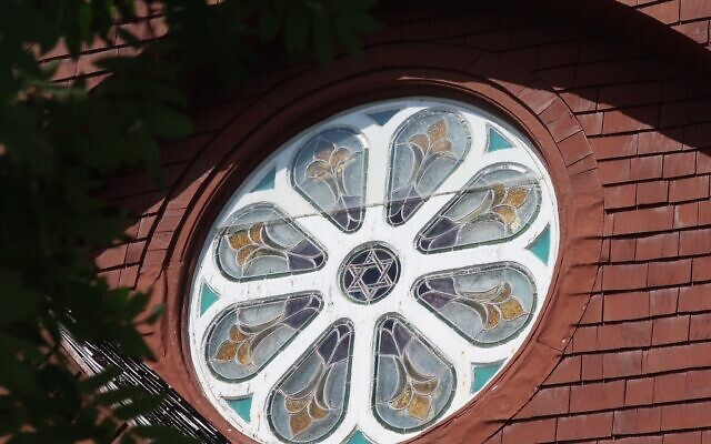 The stained-glass window at the front of the St. Peter's by the Sea Espicopal church in downtown Sitka, Alaska, features a star of David in its center. (Dan Fellner/ JTA)