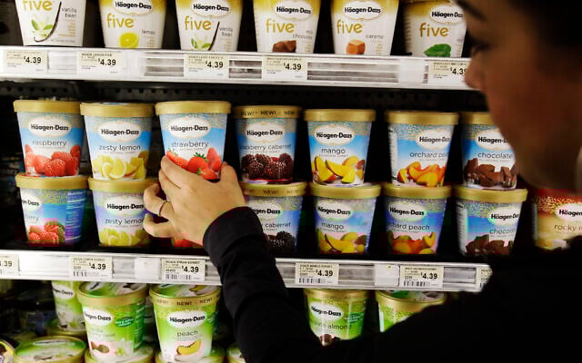 Illustrative: A shopper picks out General Mill's Haagen-Dazs ice cream at a grocery store in Palo Alto, California, June 28, 2011. (AP Photo/Paul Sakuma) Illustrative: A shopper picks out General Mill's Haagen-Dazs ice cream at a grocery store in Palo Alto, California, June 28, 2011. (AP Photo/Paul Sakuma)