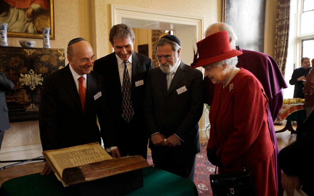 Britain's Queen Elizabeth II, right, is shown the Codex Valmadonna I book by, from left, President of Board of Deputies of British Jews Vivian Wineman, Chairman of Ostro Minerals Schweiz AG Maurice Ostro and UK Chief Rabbi Jonathan Sacks at a reception to mark the Diamond Jubilee in London, February 15, 2012. (AP Photo/Matt Dunham, Pool) Britain's Queen Elizabeth II, right, is shown the Codex Valmadonna I book by, from left, President of Board of Deputies of British Jews Vivian Wineman, Chairman of Ostro Minerals Schweiz AG Maurice Ostro and UK Chief Rabbi Jonathan Sacks at a reception to mark the Diamond Jubilee in London, February 15, 2012. (AP Photo/Matt Dunham, Pool)