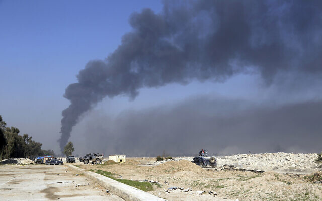 Smoke rises as Iraqi security forces deploy inside Mosul's international airport, Iraq, Feb. 24. 2017. (AP Photo/ Khalid Mohammed) Smoke rises as Iraqi security forces deploy inside Mosul's international airport, Iraq, Feb. 24. 2017. (AP Photo/ Khalid Mohammed)