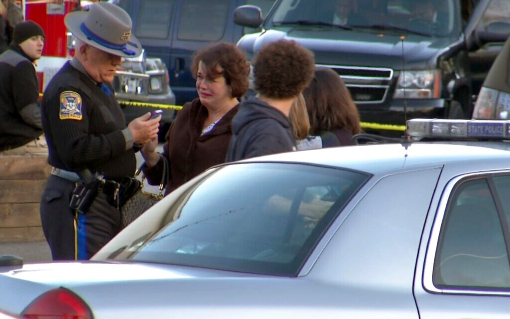 Veronique Pozner reacts with grief after learning that a gunman killed her son Noah at Sandy Hook Elementary School in Newtown, Connecticut, December 14, 2012. (AP Photo/Ted Shaffrey)