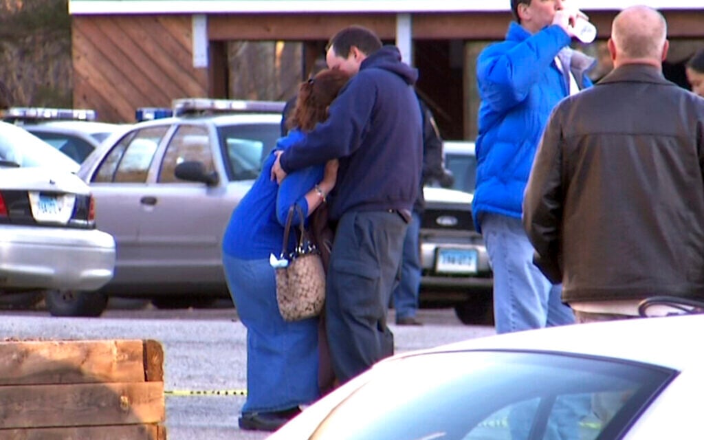 Jackie Barden reacts with grief after learning that a gunman killed her son Daniel at Sandy Hook Elementary School in Newtown, Connecticut,  December 14, 2012. (AP Photo/Ted Shaffrey)