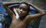 Illustrative: Angel Cespedes, 14, who is in need of a kidney transplant, lies in bed feeling unwell after dialysis treatment at his home in Valles del Tuy on the outskirts of Caracas, Venezuela, November 8, 2021. (AP Photo/Ariana Cubillos)