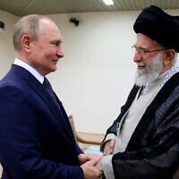 Iran's Supreme Leader Ayatollah Ali Khamenei, right, and Russian President Vladimir Putin greet each other during their meeting in Tehran, Iran, July 19, 2022. (Office of the Iranian Supreme Leader via AP)